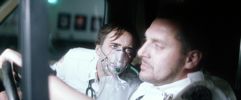 Nicolas Cage as Frank Pierce Wearing an Oxygen Mask