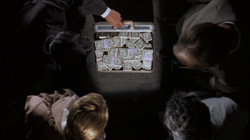 The Con Men Find a Suitcase Full of Money
