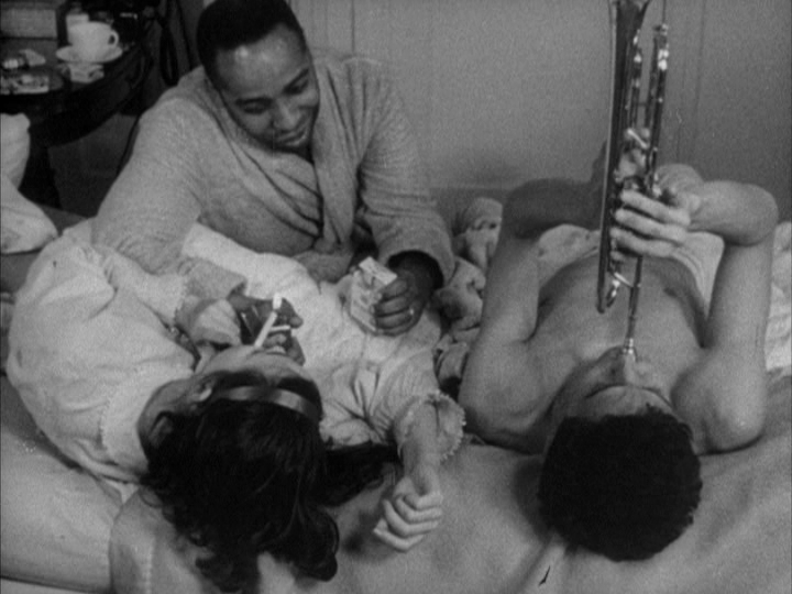 The Siblings Relax on the Bed Smoking and Playing Trumpet