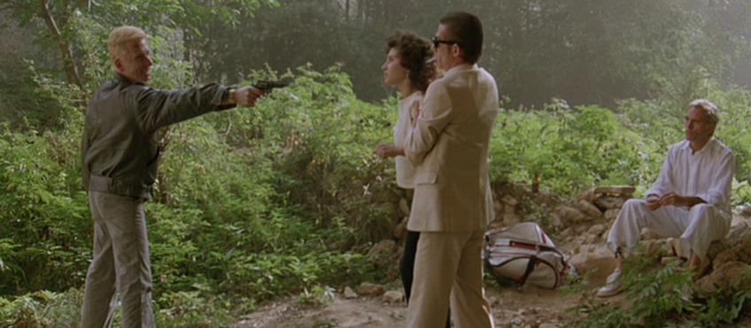 Tim Roth as Myron Pointing a Gun