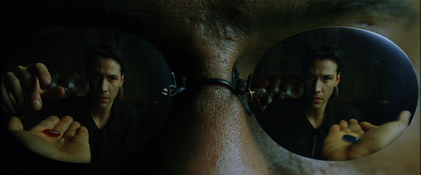 The Red and Blue Pill Reflected in Morpheus's Glasses