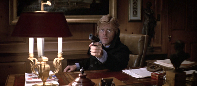 Robert Redford as Joe Turner Pointing a Gun Off Screen
