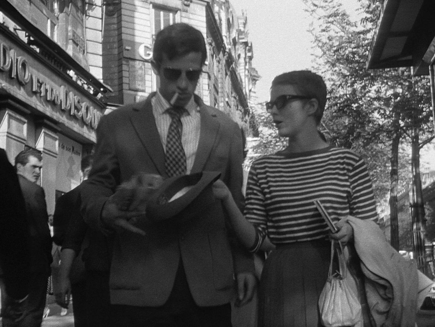 Michel and Patricia Walk Down the Street