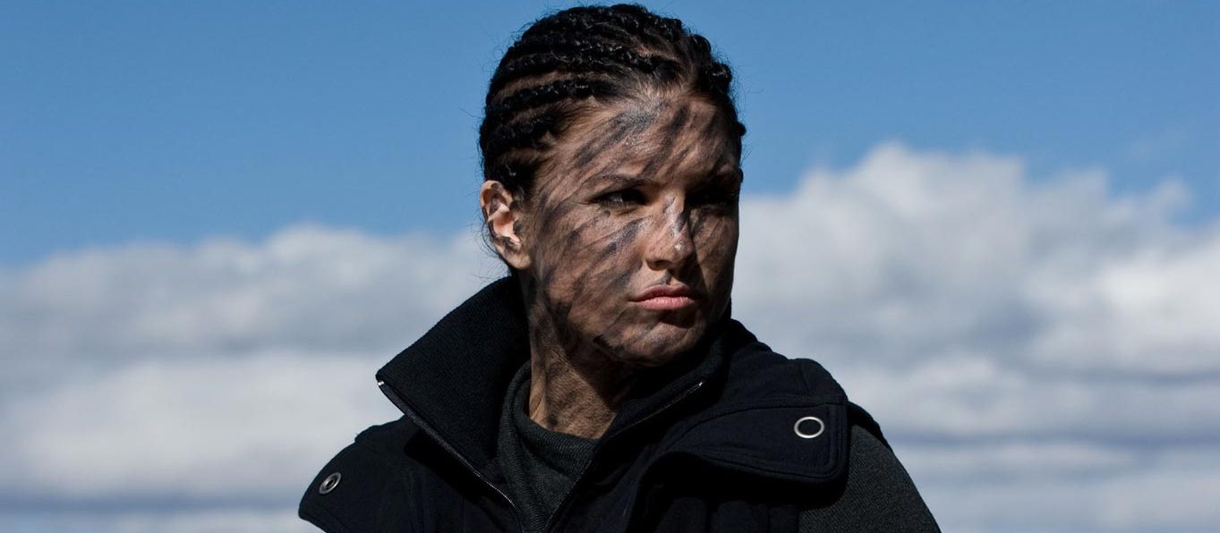 Gina Carano in Face Paint and Corn Rows