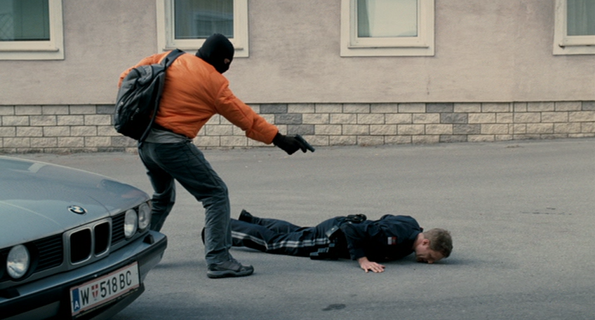 Alex Forces Robert Onto the Ground Using an Unloaded Gun