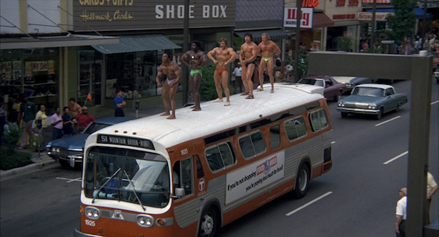 Bodybuilders on Top of a Bus